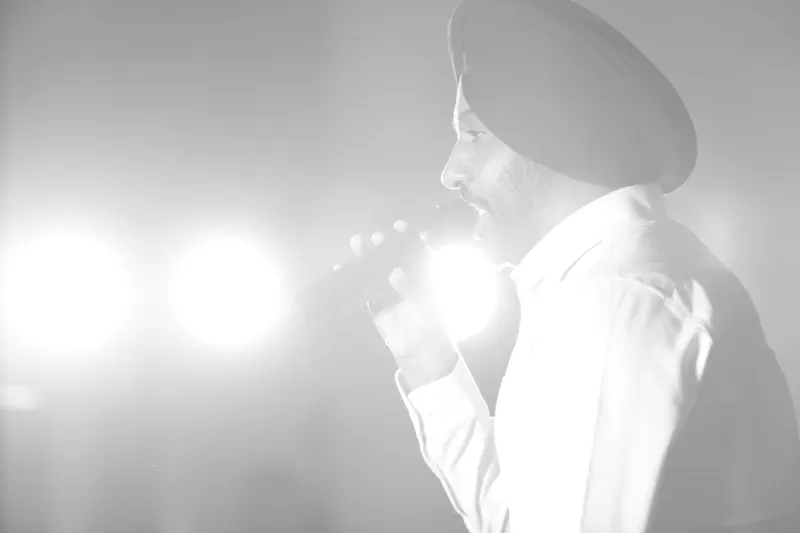 Backlit singer in stage haze, black and white